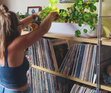 Girl growing plants in the Click & Grow smart garden 9